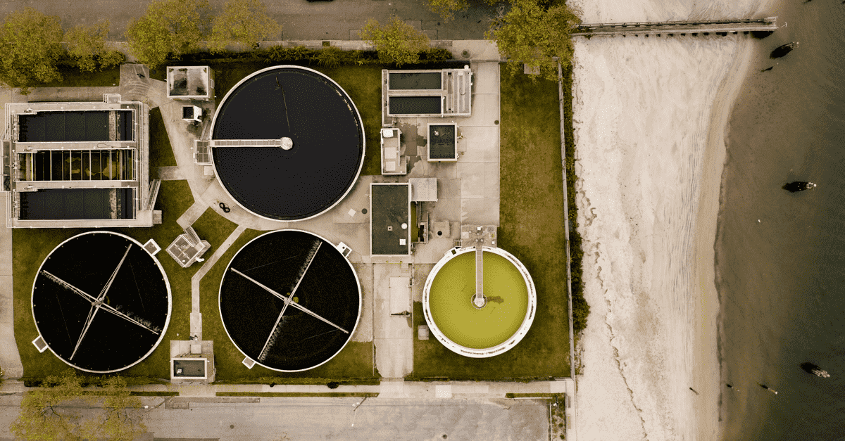 Aerial photo of a municipal water treatment plant with multiple clarifiers 