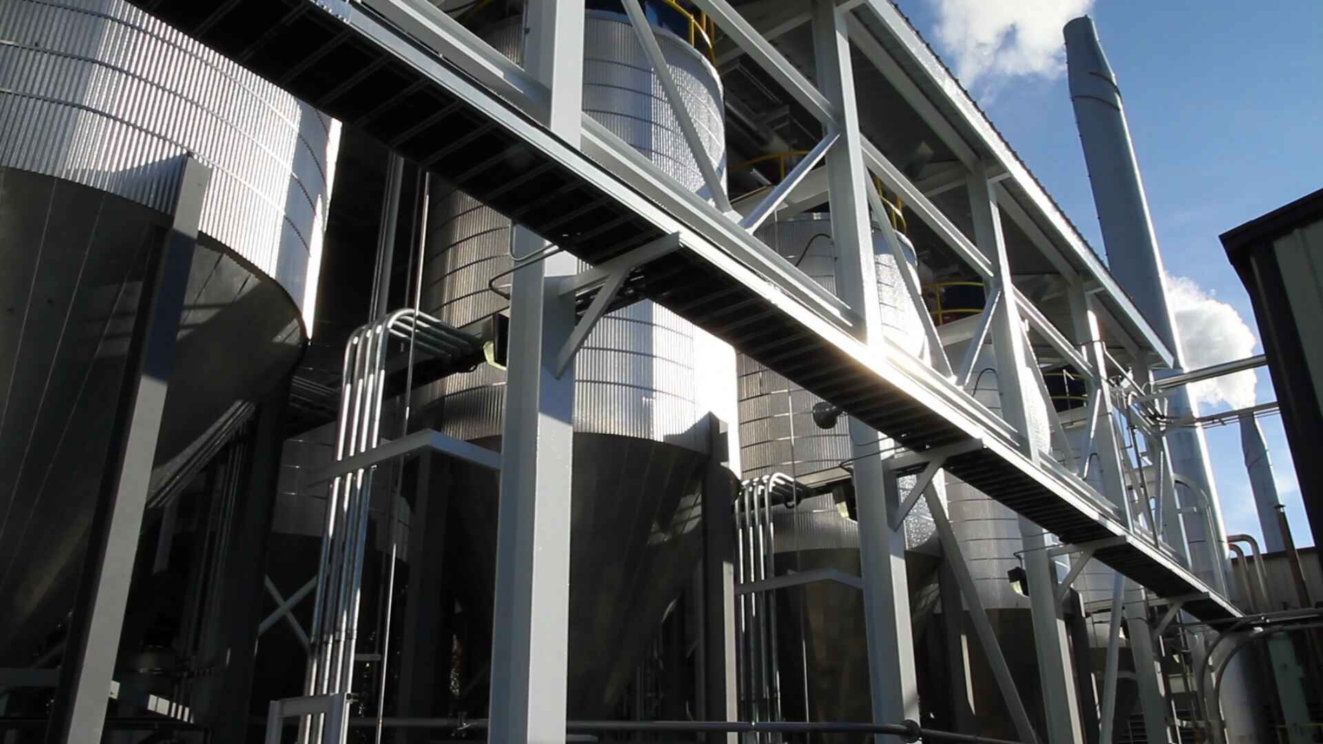 Photo of a line of steel storage silos 